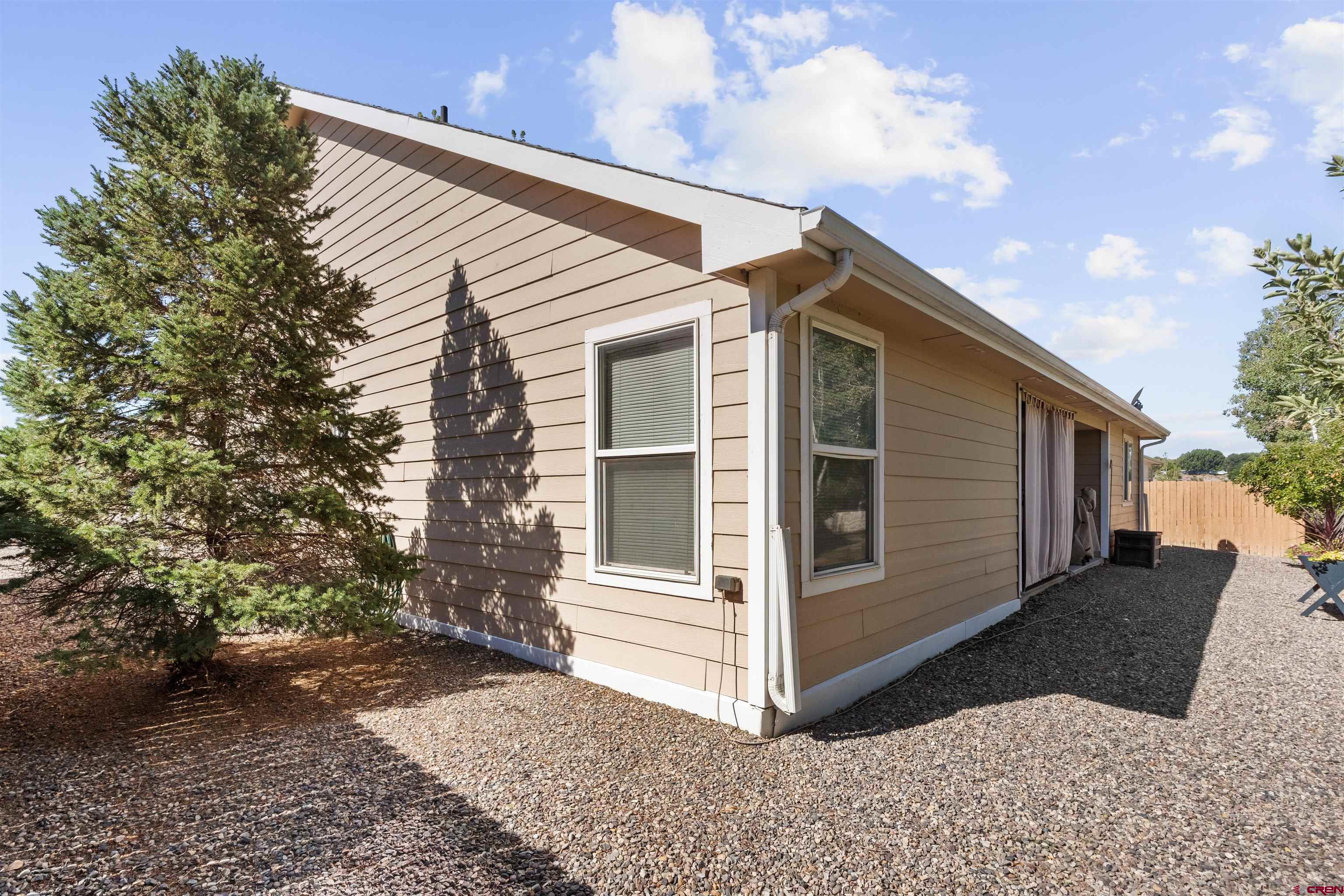 505 20th Street Delta, CO 81416 - Photo 20 of 22 a view of a house with a yard