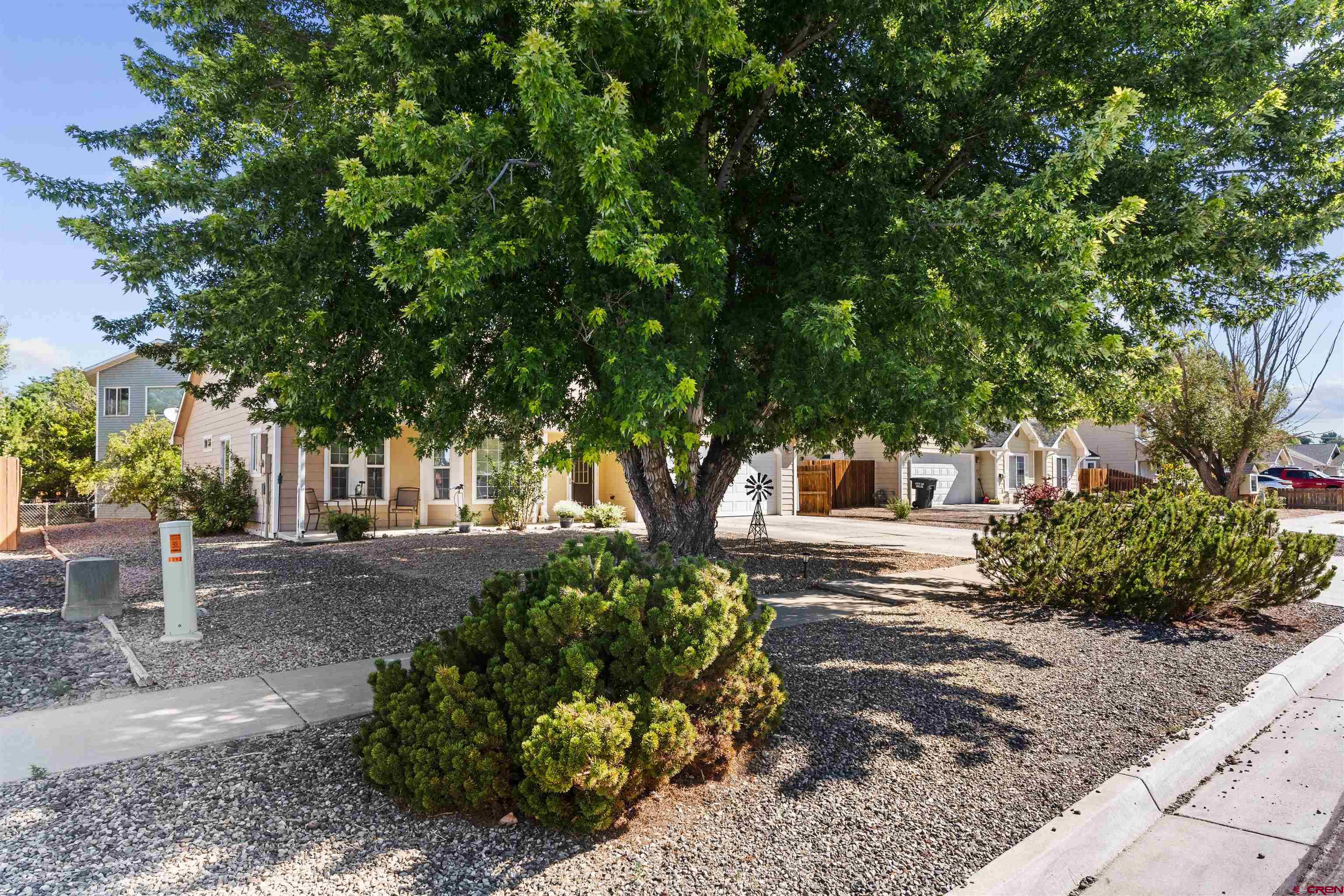 505 20th Street Delta, CO 81416 - Photo 22 of 22 a front view of a house with garden