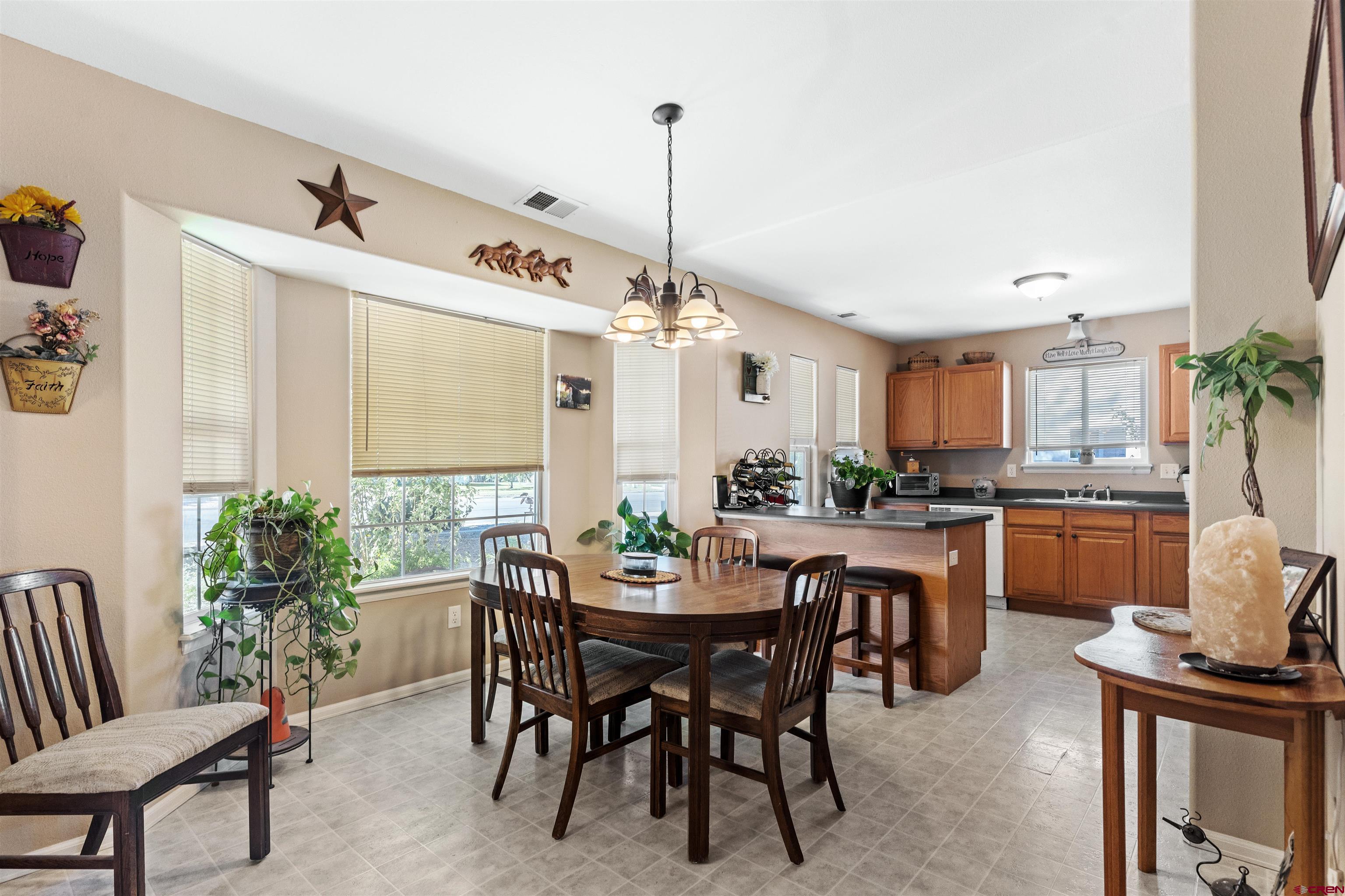 505 20th Street Delta, CO 81416 - Photo 3 of 22 a dining room with furniture window and wooden floor