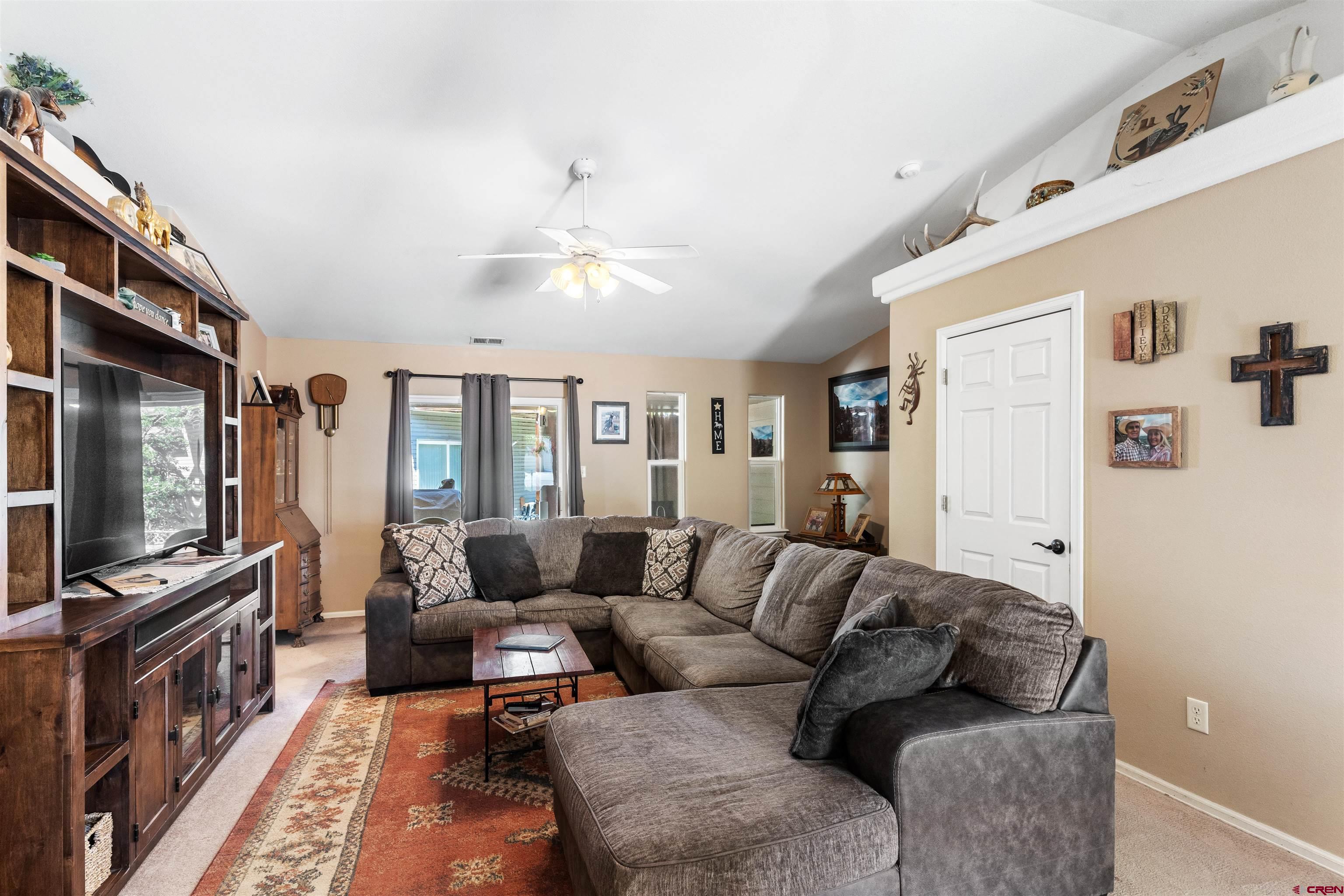505 20th Street Delta, CO 81416 - Photo 7 of 22 a living room with furniture and a flat screen tv