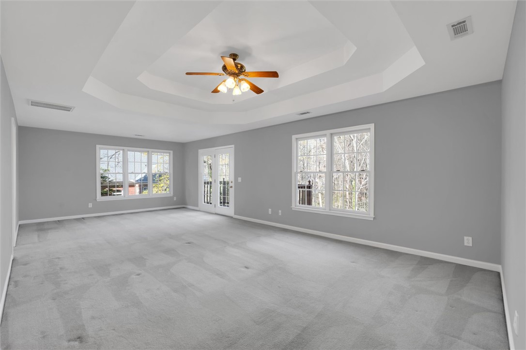 204 Red Maple Way Clemson, SC 29631 - Photo 24 of 48 This spacious primary bedroom features soft carpeting, ample natural light, and a private balcony.
