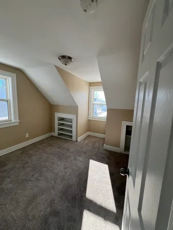a view of livingroom with furniture and windows