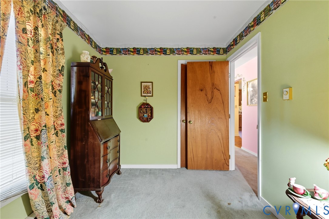 5606 Retriever Road Richmond, VA 23237 - Photo 12 of 27 a view of an front door and wooden floor