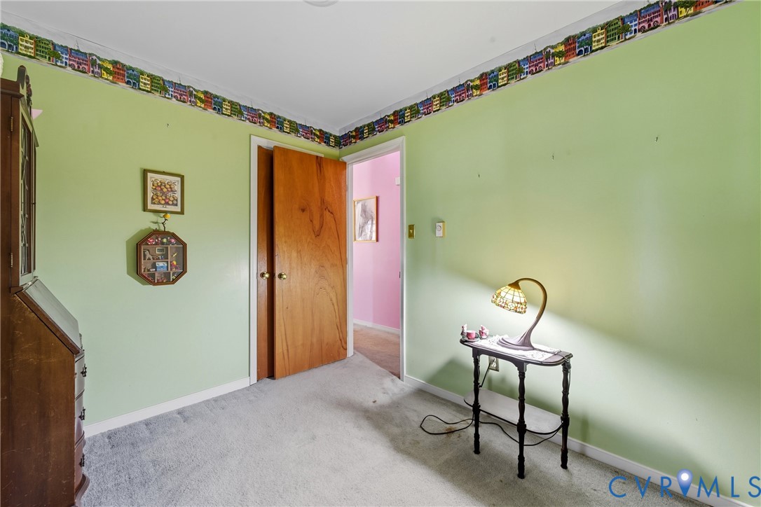 5606 Retriever Road Richmond, VA 23237 - Photo 13 of 27 a view of a hallway with paintings on the wall