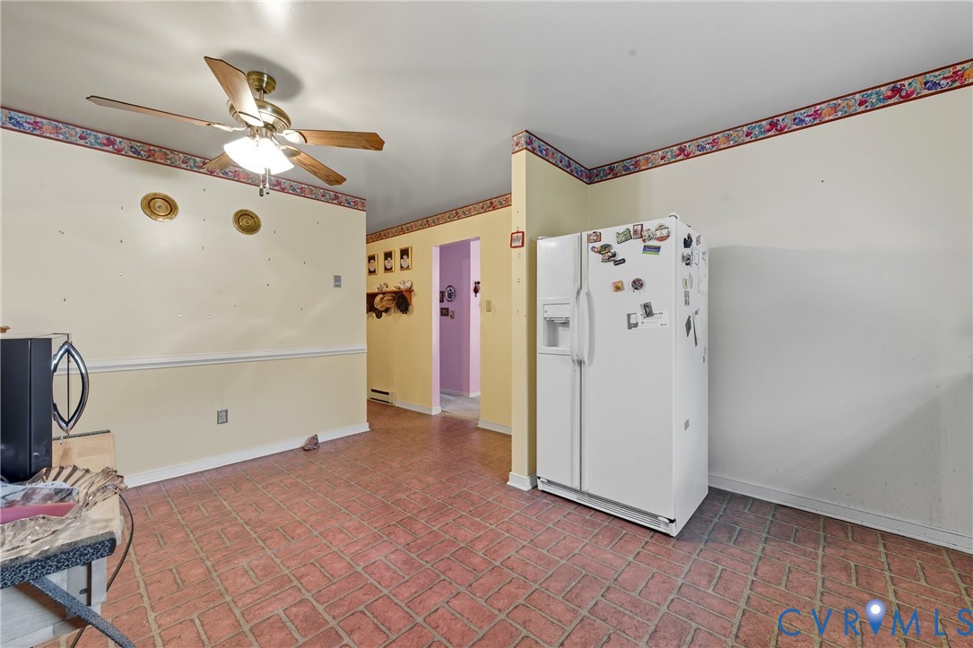 5606 Retriever Road Richmond, VA 23237 - Photo 8 of 27 a view of a livingroom with wooden floor and white walls