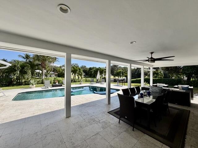 100 Southwest 11th Avenue Boca Raton, FL 33486 - Photo 14 of 34 a living room with furniture and a large window