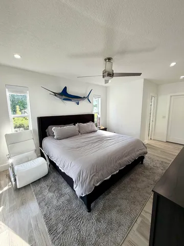 a bedroom with a bed and a couch