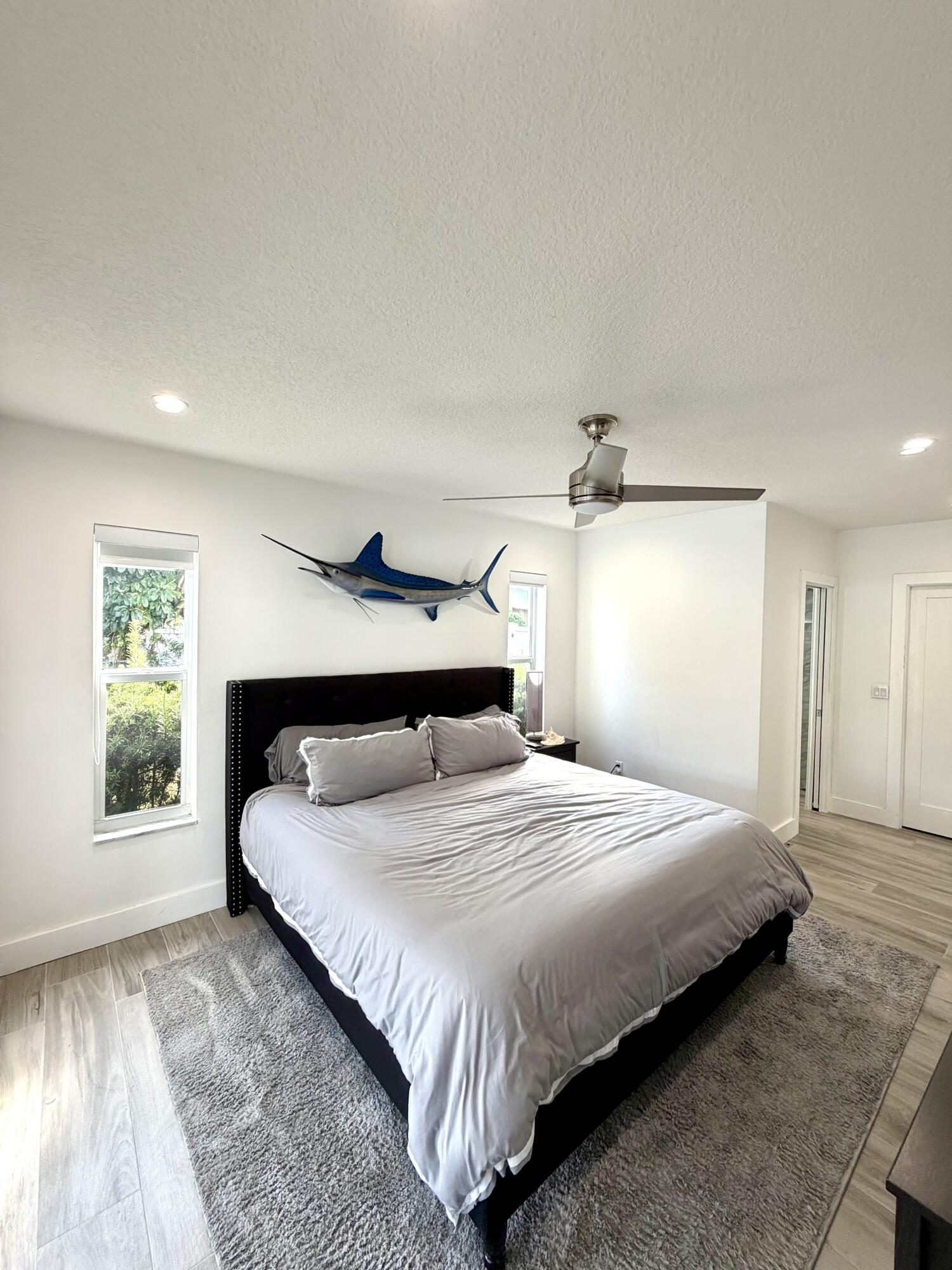 100 Southwest 11th Avenue Boca Raton, FL 33486 - Photo 18 of 34 a bedroom with a bed and a window