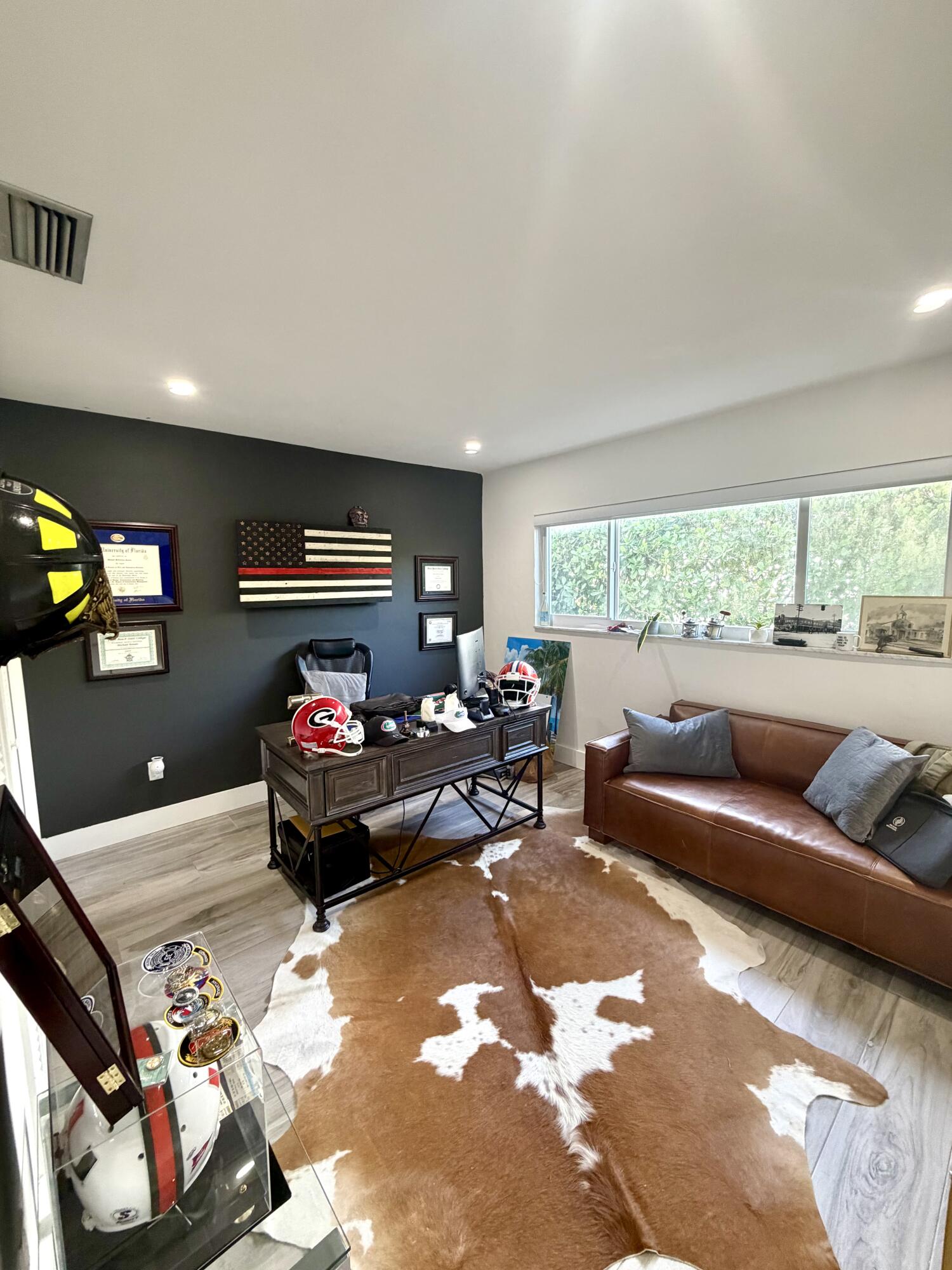 100 Southwest 11th Avenue Boca Raton, FL 33486 - Photo 22 of 34 a living room with furniture and a flat screen tv