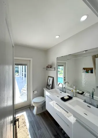 a room with a large window and furniture