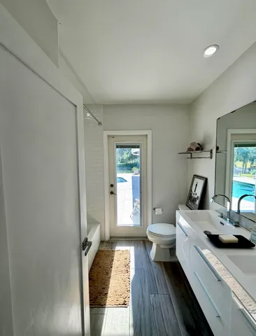 a en suite bathroom with a sink and mirror