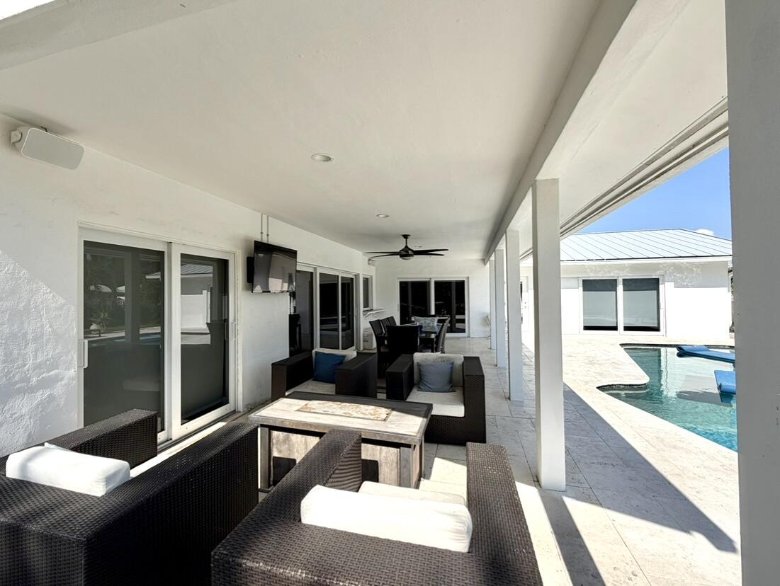 100 Southwest 11th Avenue Boca Raton, FL 33486 - Photo 31 of 34 a living room with furniture rug and outdoor view
