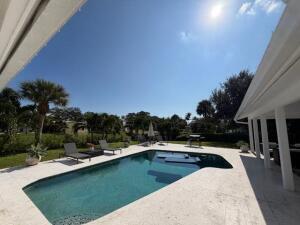 100 Southwest 11th Avenue Boca Raton, FL 33486 - Photo 32 of 34 a view of swimming pool with outdoor seating and plants