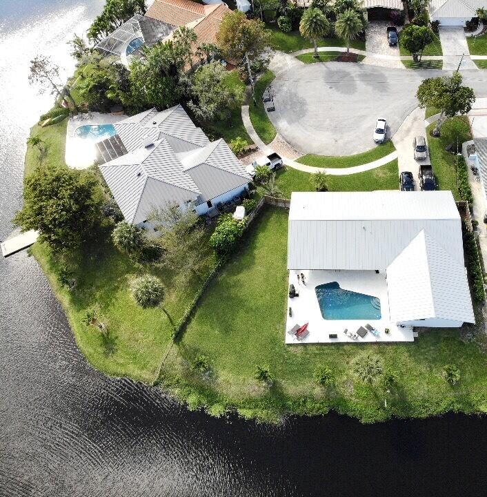 100 Southwest 11th Avenue Boca Raton, FL 33486 - Photo 34 of 34 an aerial view of a house with a yard and lake view
