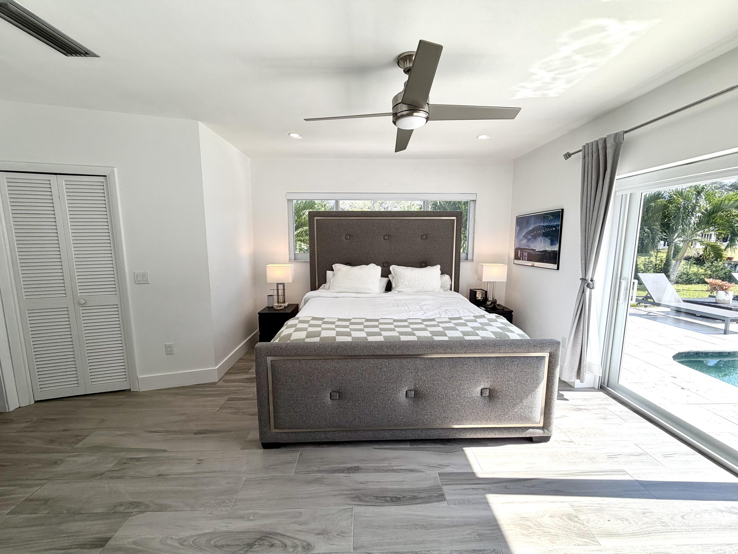 100 Southwest 11th Avenue Boca Raton, FL 33486 - Photo 5 of 34 a bedroom with a bed and a window