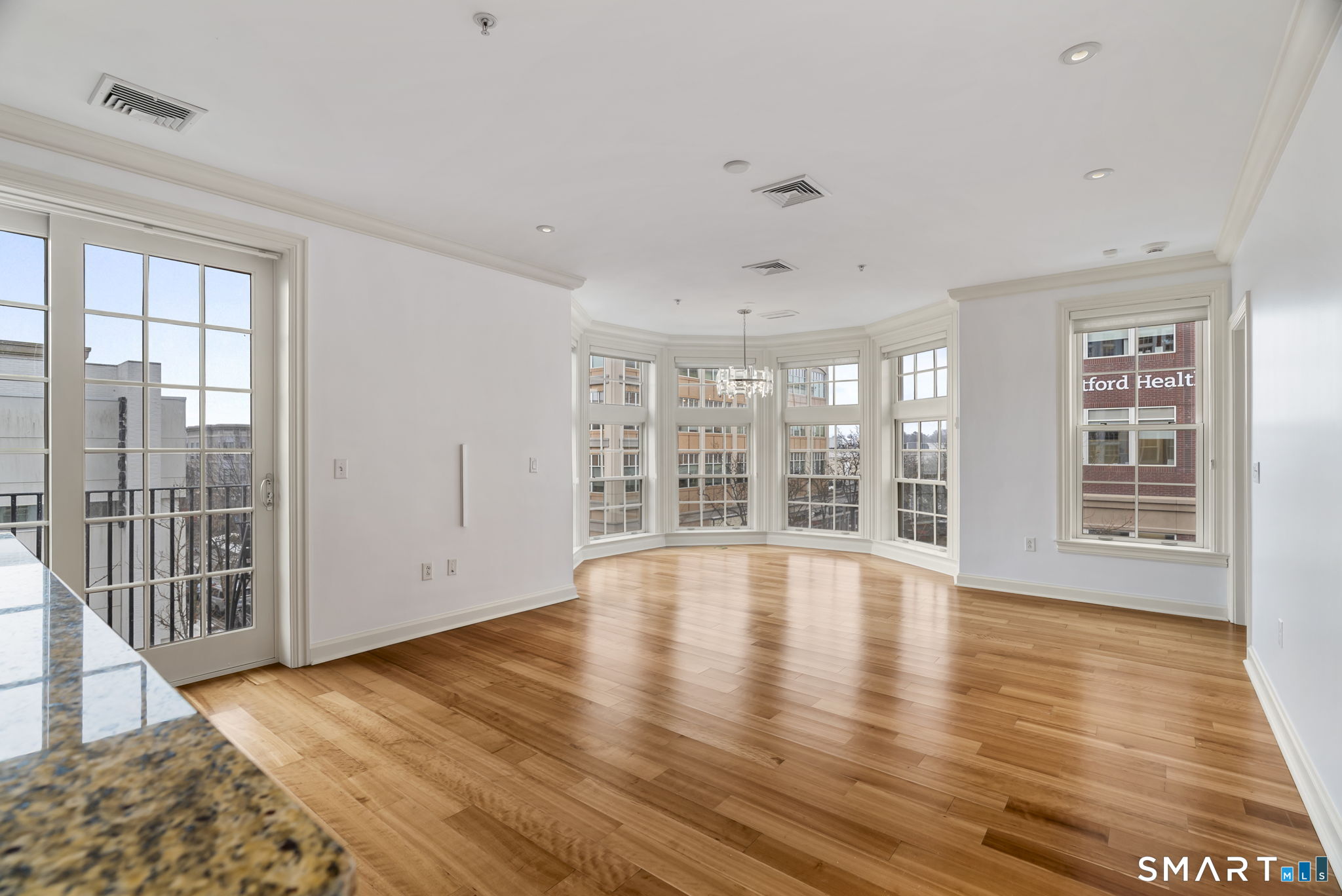 85 Memorial Road, Unit 313 West Hartford, CT 06107 - Photo 4 of 30 Open living space with incredible light