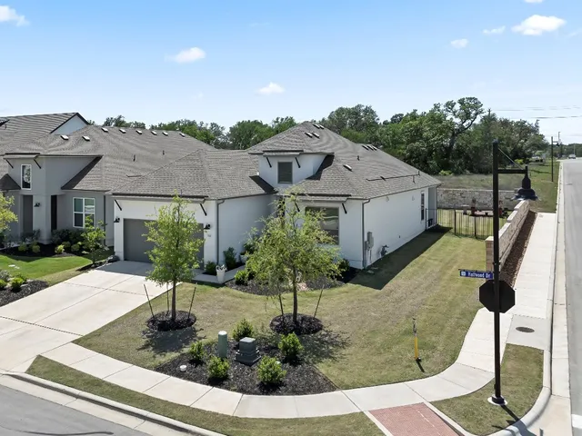 a front view of a house with yard