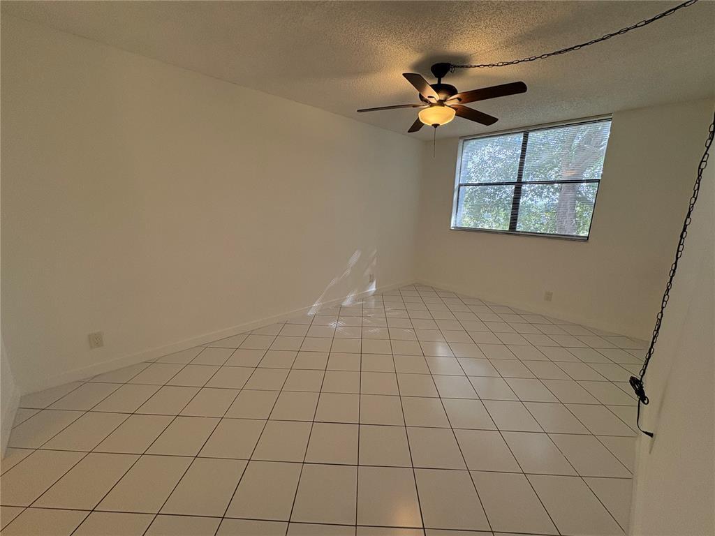 2401 Riverside Drive, Unit 314B Coral Springs, FL 33065 - Photo 5 of 11 a view of an empty room and window