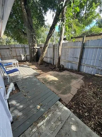 a view of backyard with seating space