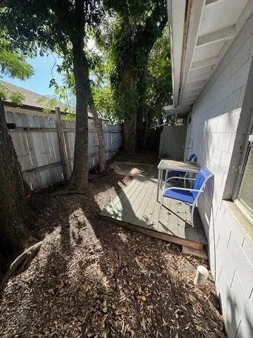 a view of a kitchen with a sink and a refrigerator
