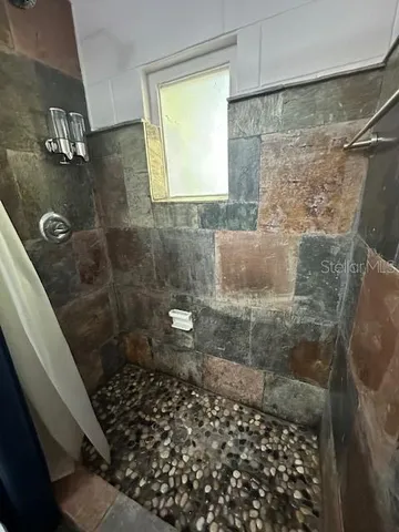 a spacious bathroom with a double vanity sink and a mirror