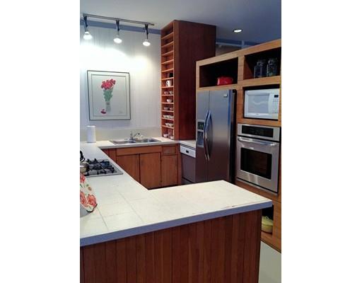 7 Upson Road Wellesley, MA 02482 - Photo 10 of 18 a kitchen with stainless steel appliances a microwave and a refrigerator