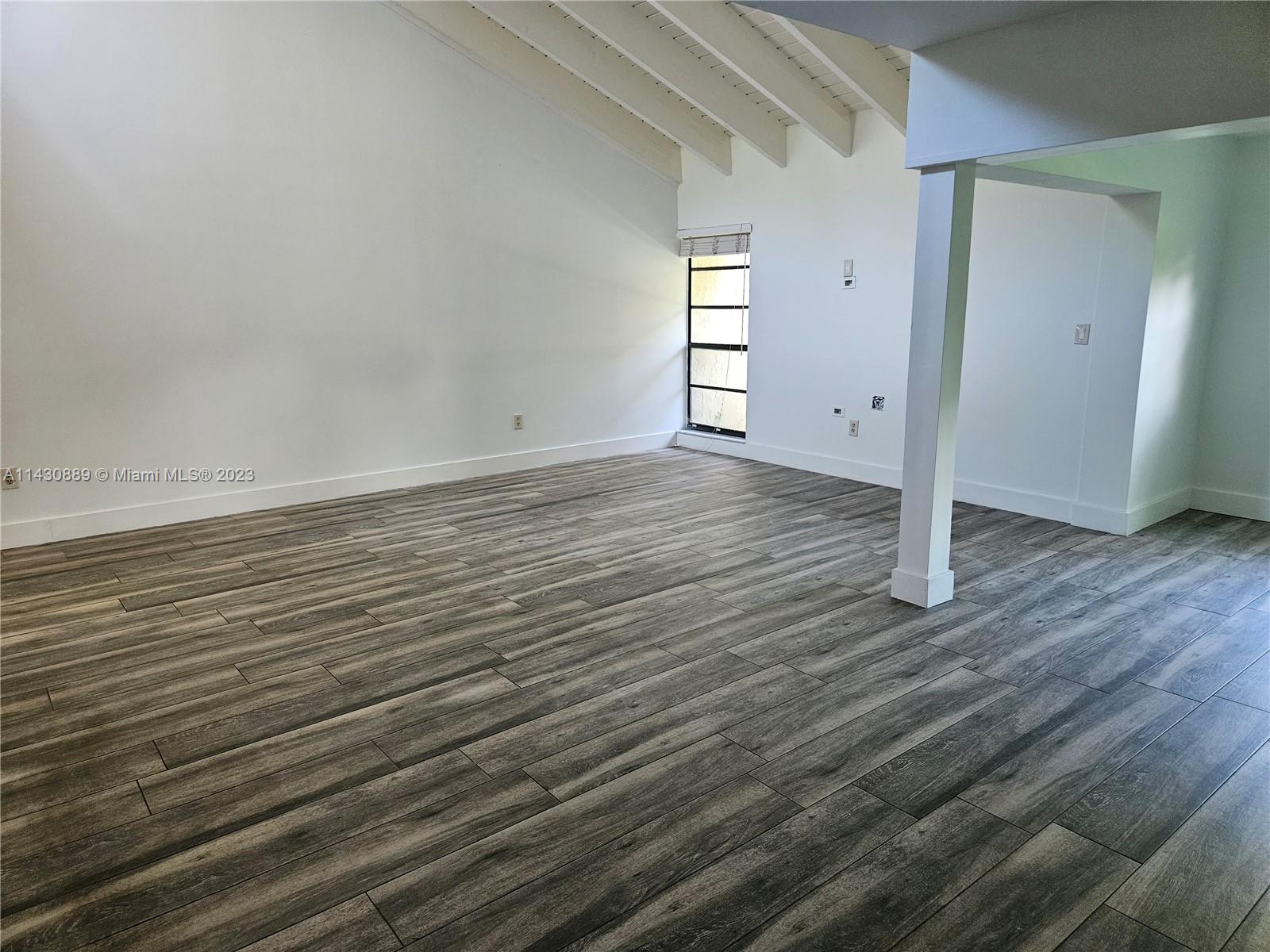 9194 Southwest 132nd Lane, Unit 1 Miami, FL 33176 - Photo 2 of 11 a view of a room with wooden floor
