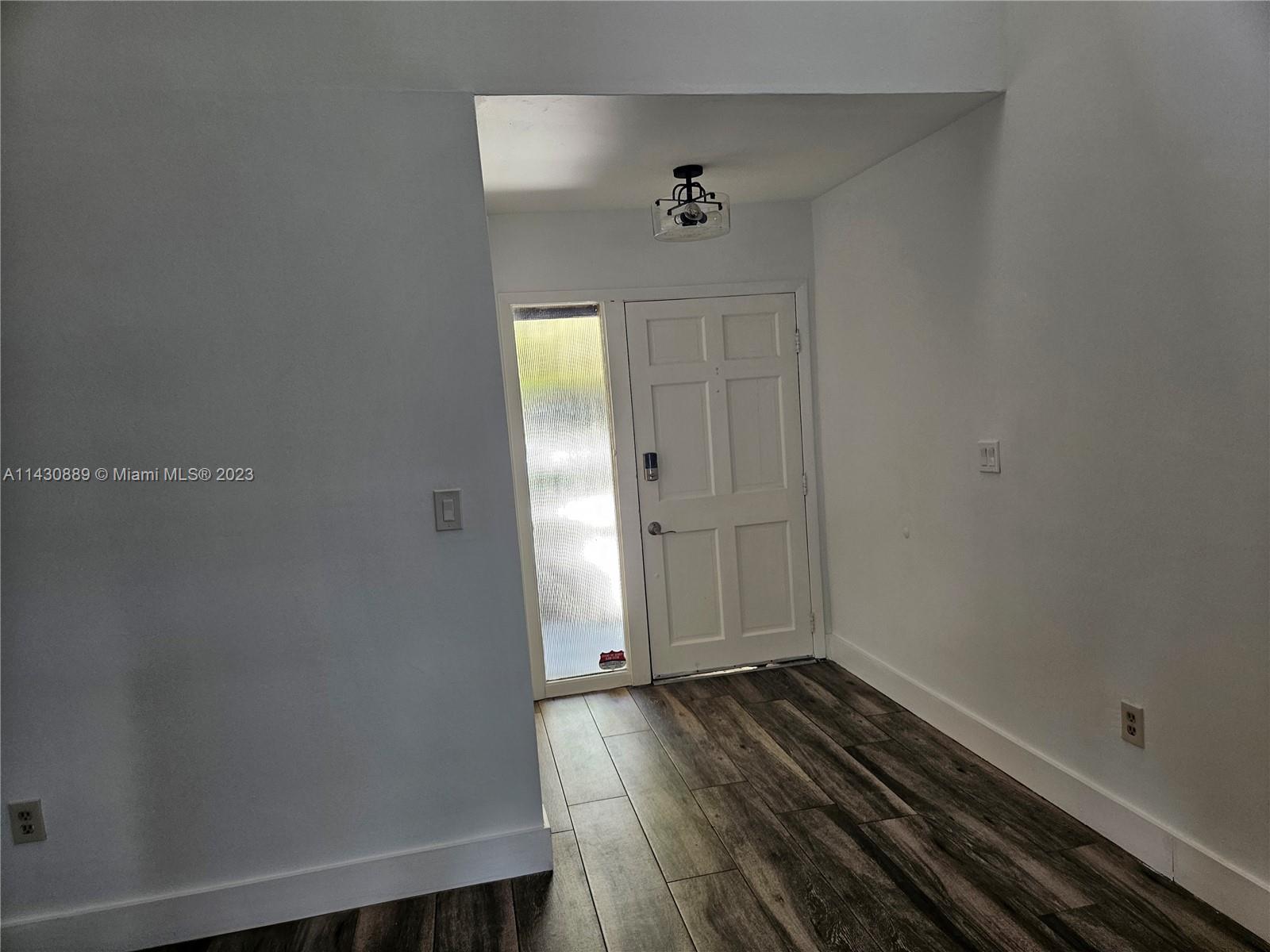 9194 Southwest 132nd Lane, Unit 1 Miami, FL 33176 - Photo 7 of 11 a view of a room with wooden floor