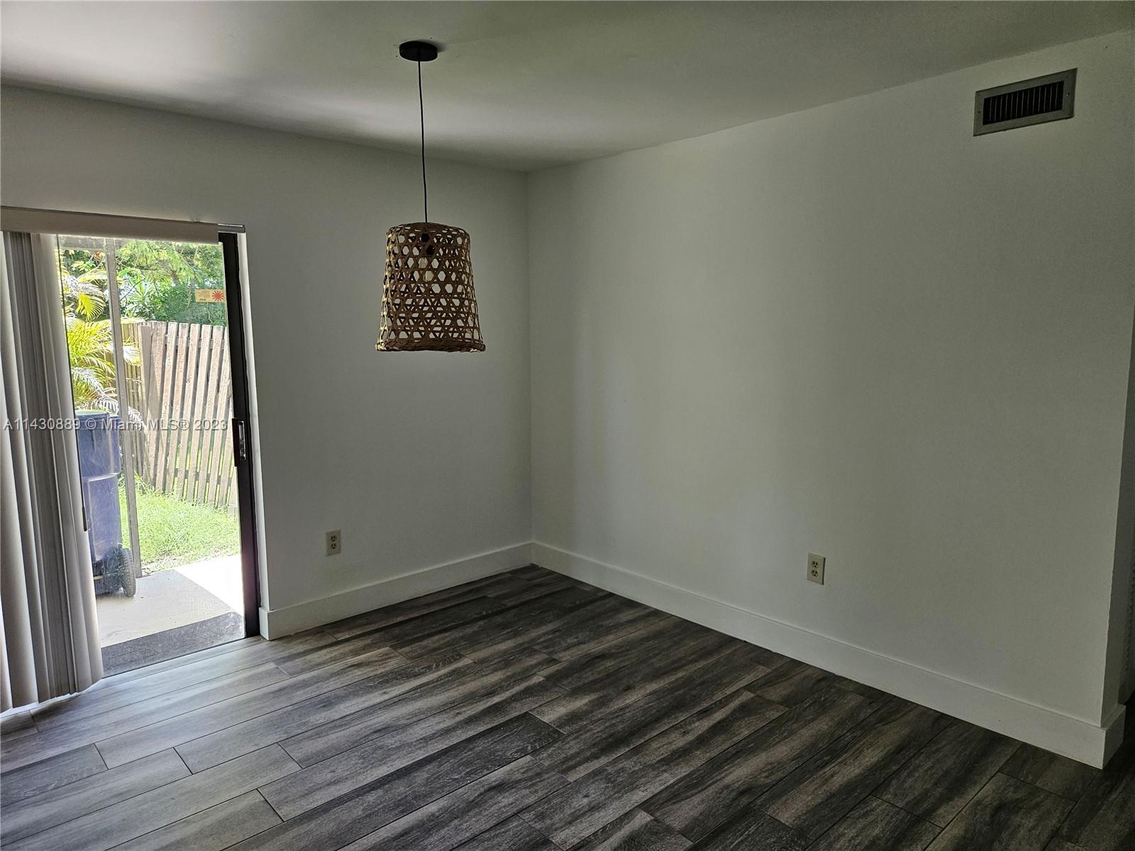 9194 Southwest 132nd Lane, Unit 1 Miami, FL 33176 - Photo 10 of 11 a view of an entryway with wooden floor