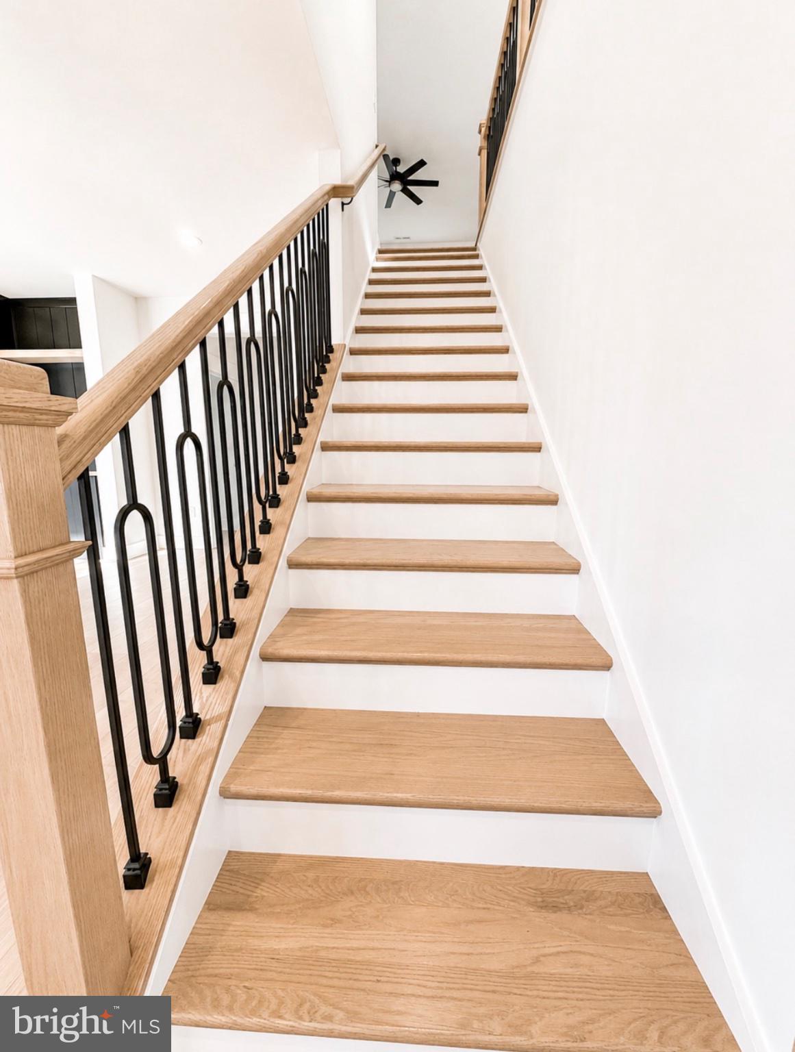 21963 Hardscrabble Road Georgetown, DE 19947 - Photo 31 of 43 Elegant staircase with modern flair.