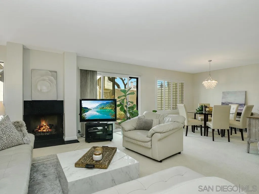 16055 Vista De Golf Rancho Santa Fe, CA 92091 - Photo 1 of 35 a living room with furniture a fireplace a flat screen tv and a fireplace