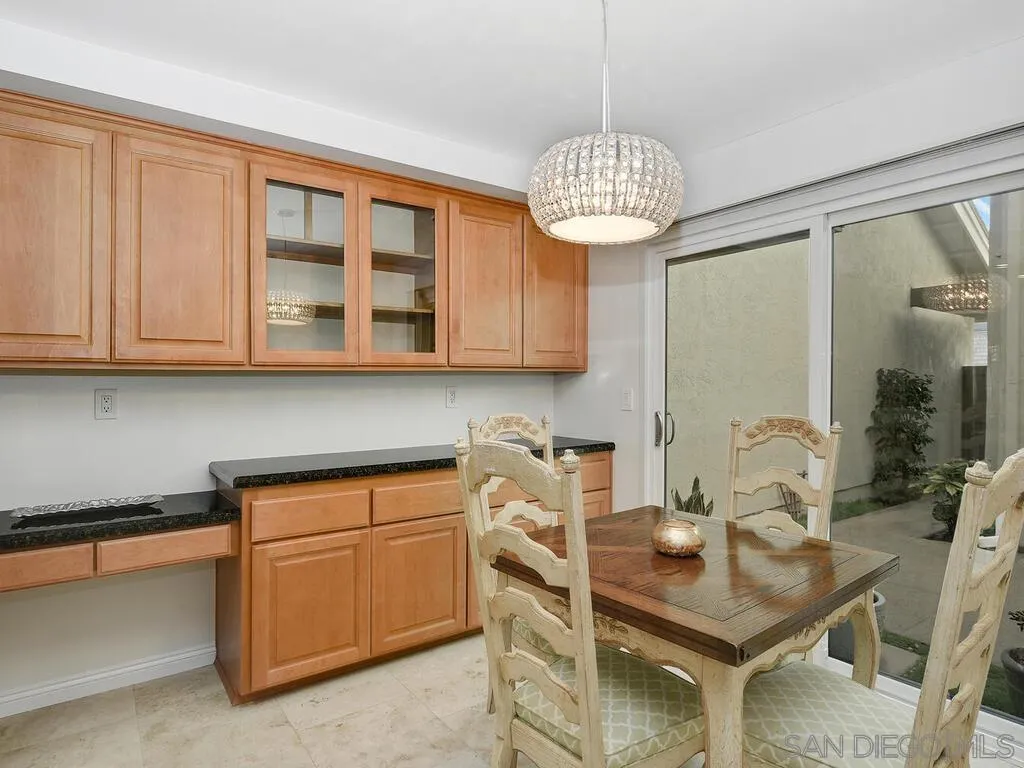 16055 Vista De Golf Rancho Santa Fe, CA 92091 - Photo 12 of 35 a view of a kitchen area with furniture and chandelier