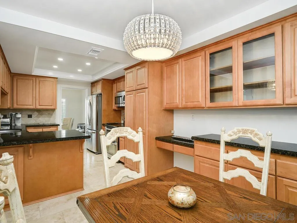 16055 Vista De Golf Rancho Santa Fe, CA 92091 - Photo 13 of 35 a kitchen with granite countertop a stove a sink and cabinets