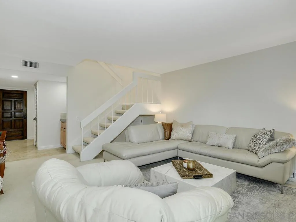 16055 Vista De Golf Rancho Santa Fe, CA 92091 - Photo 6 of 35 a living room with furniture and stairs