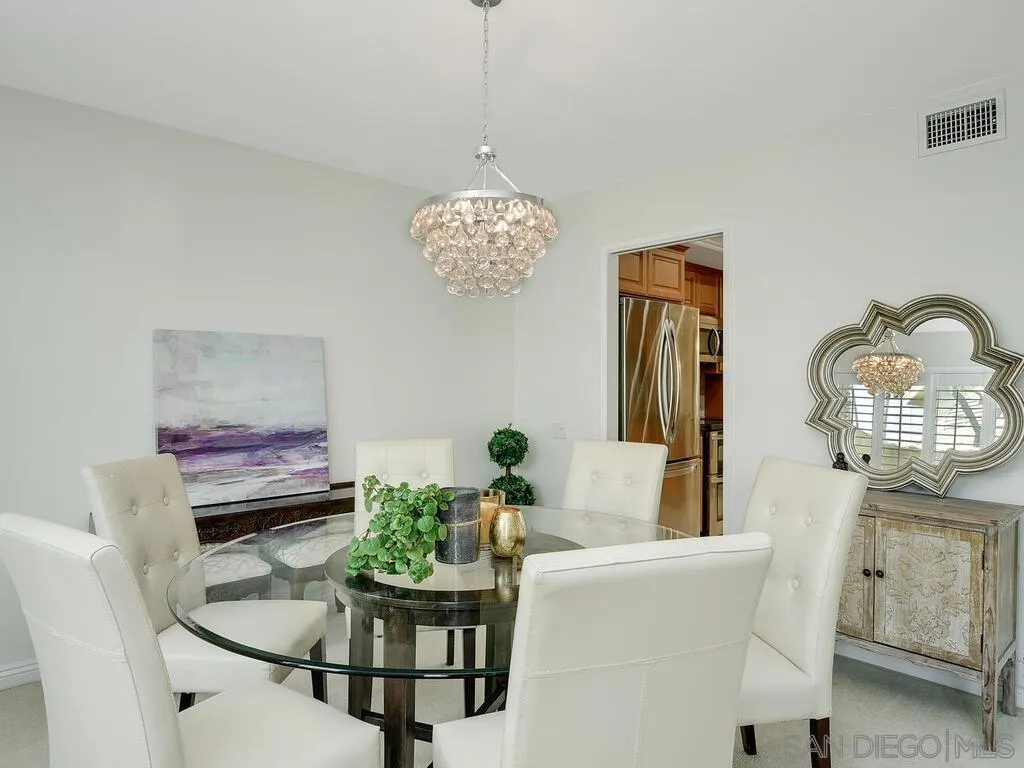16055 Vista De Golf Rancho Santa Fe, CA 92091 - Photo 8 of 35 a dining room with chandelier and wooden floor