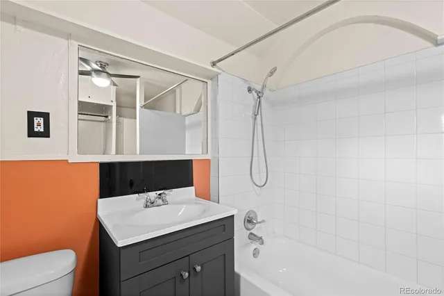 a bathroom with a sink a mirror and a shower