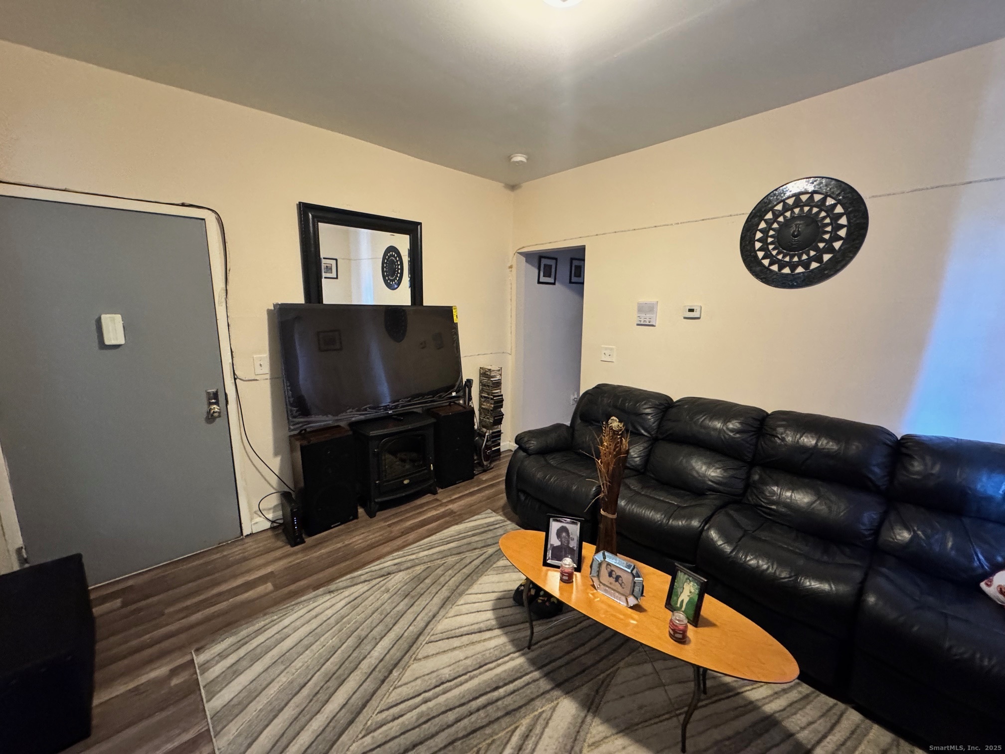 204 Magnolia Street, Unit 2S Hartford, CT 06112 - Photo 2 of 11 a living room with furniture and a flat screen tv