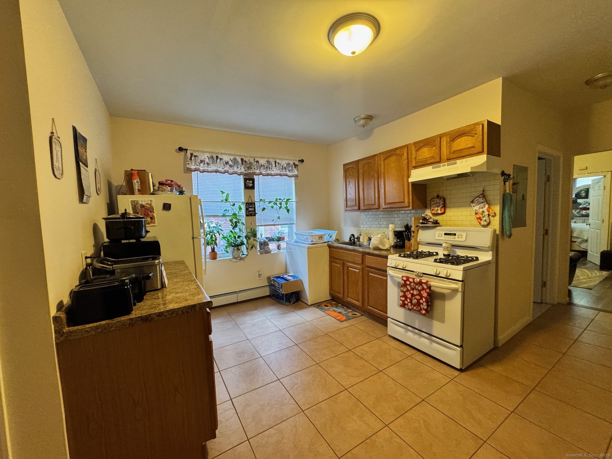 204 Magnolia Street, Unit 2S Hartford, CT 06112 - Photo 3 of 11 a kitchen with a cabinets and appliances