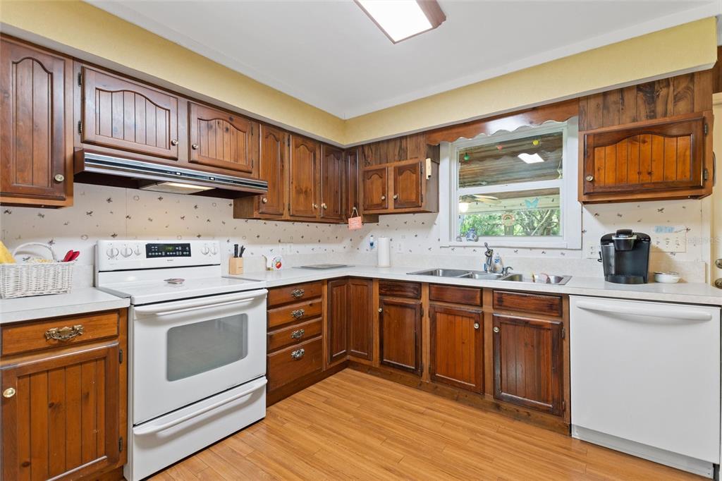3641 Turtle Mound Road Melbourne, FL 32934 - Photo 8 of 77 a kitchen with stainless steel appliances granite countertop a stove sink and cabinets