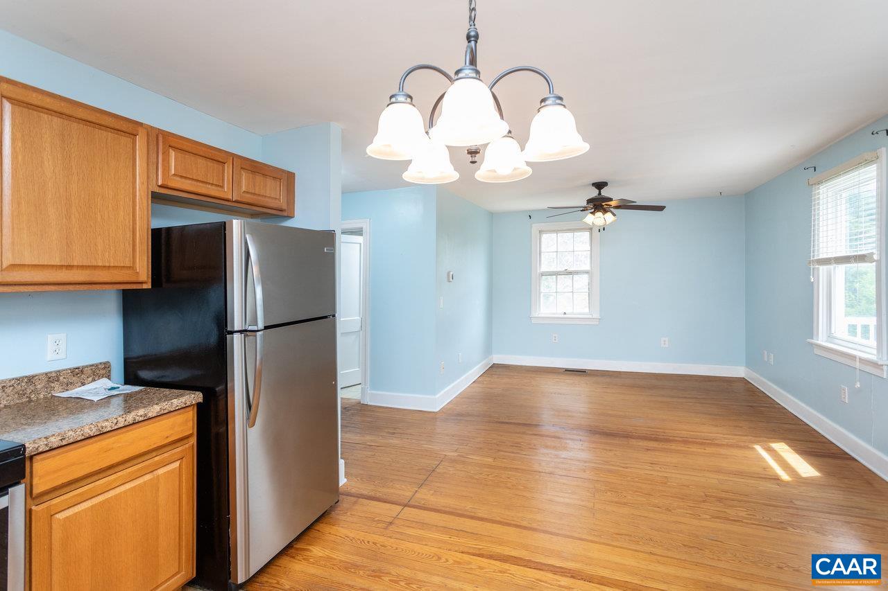 703 Monroe Street Staunton, VA 24401 - Photo 12 of 46 a kitchen with stainless steel appliances granite countertop a refrigerator a stove a sink and a window