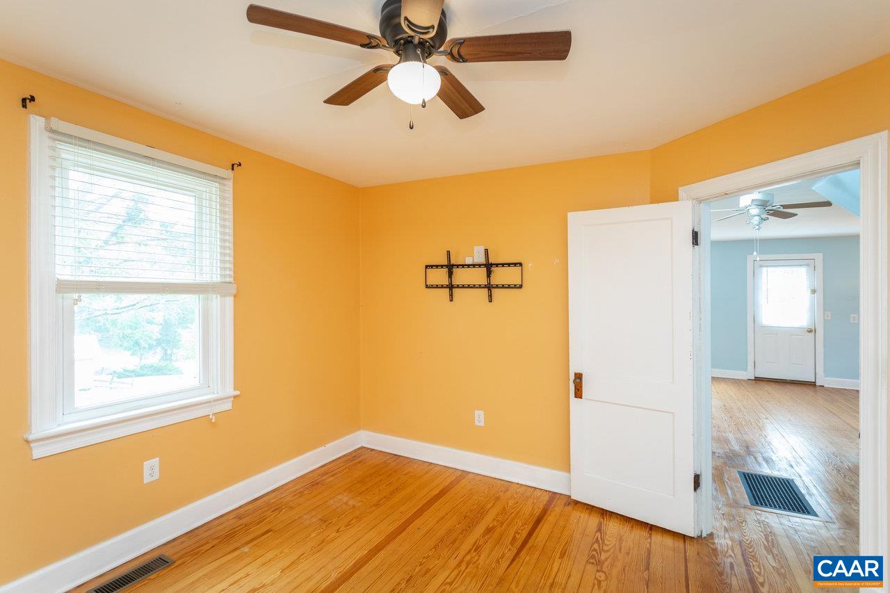 703 Monroe Street Staunton, VA 24401 - Photo 19 of 46 a view of empty room with wooden floor and fan