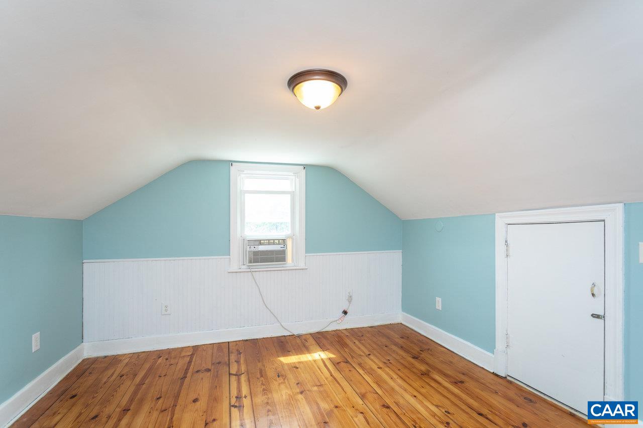703 Monroe Street Staunton, VA 24401 - Photo 23 of 46 a view of a room with wooden floor and white walls