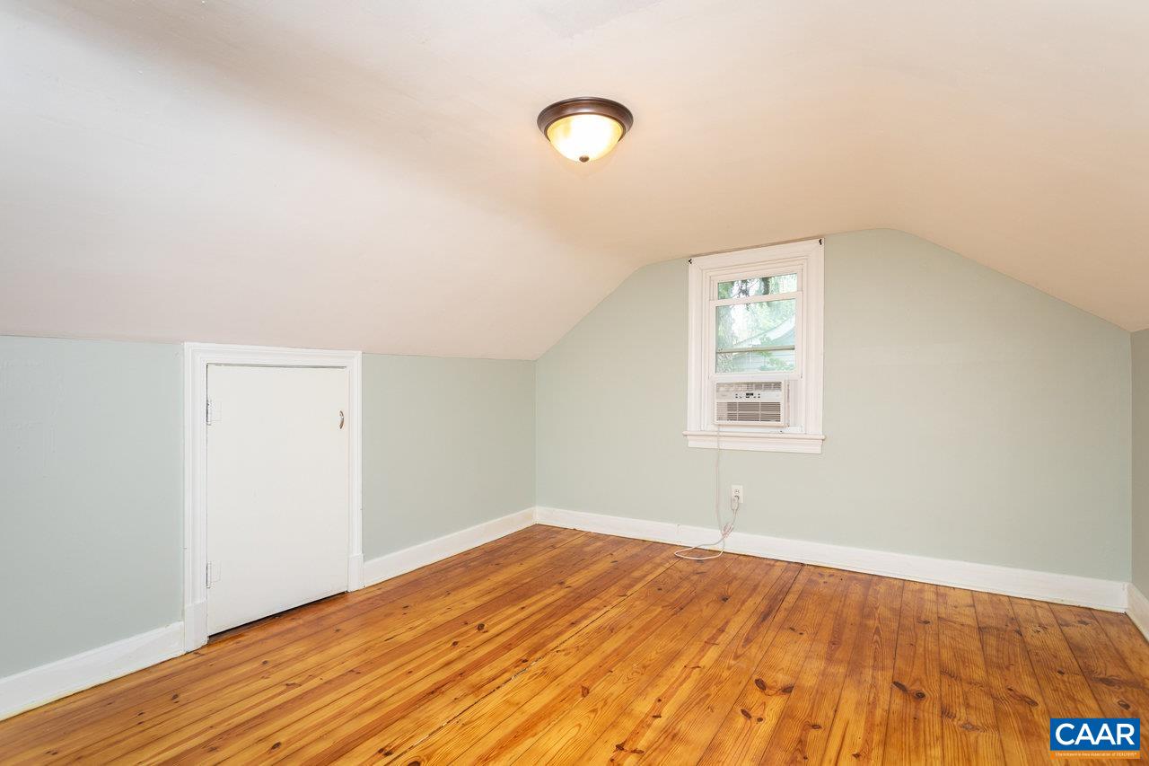 703 Monroe Street Staunton, VA 24401 - Photo 27 of 46 an empty room with wooden floor and windows