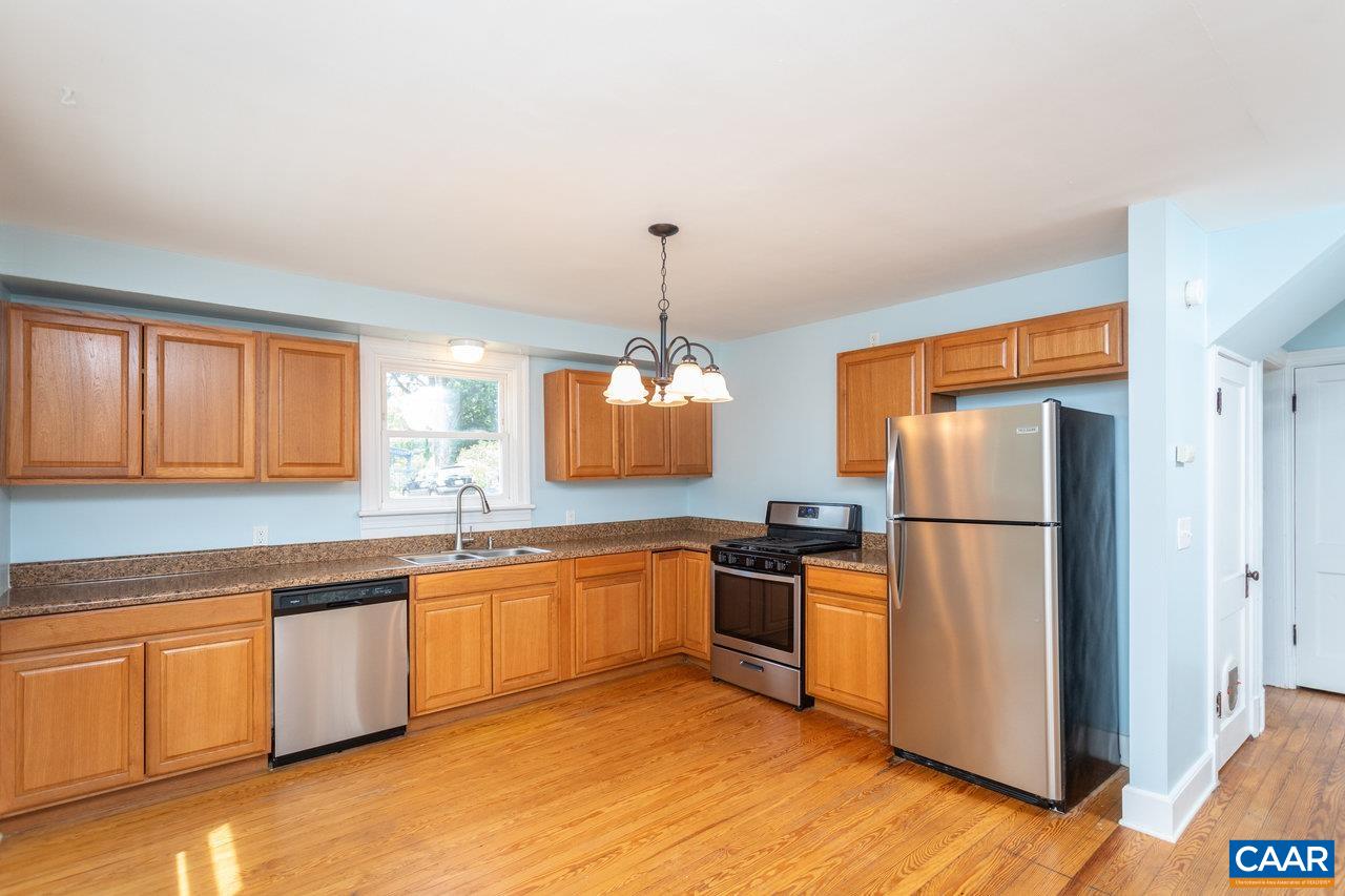 703 Monroe Street Staunton, VA 24401 - Photo 10 of 46 a kitchen with stainless steel appliances granite countertop a refrigerator a stove a sink and a microwave