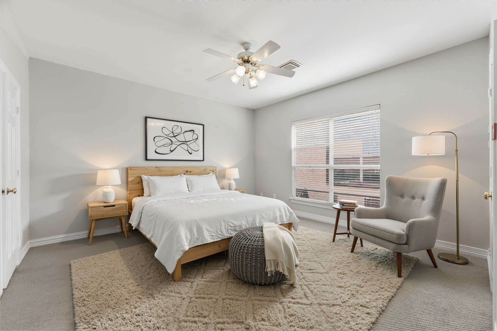 827 Rosine Street Houston, TX 77019 - Photo 4 of 50 Experience the serene elegance of this virtually staged bedroom, featuring soft neutral tones, modern furnishings, and abundant natural light, creating a cozy retreat for relaxation.
