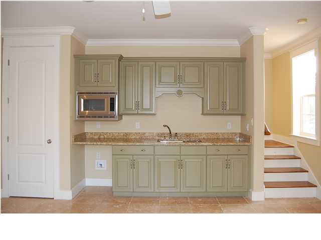 492 West Harborview Road Santa Rosa Beach, FL 32459 - Photo 12 of 16 a kitchen with granite countertop a sink cabinets and a wooden floor