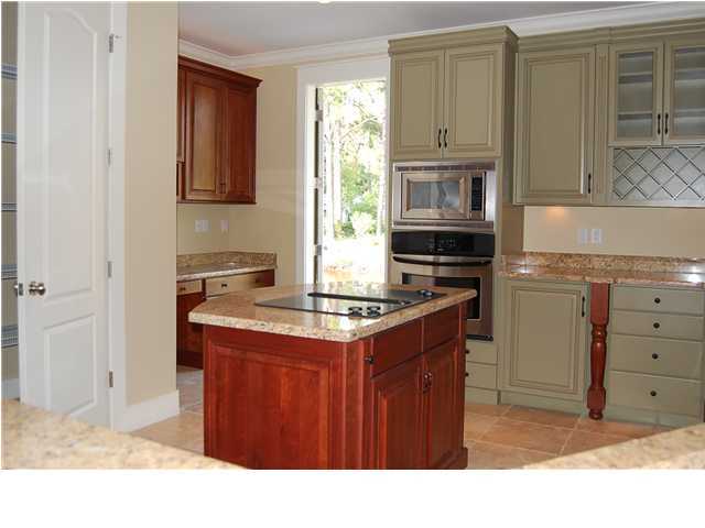 492 West Harborview Road Santa Rosa Beach, FL 32459 - Photo 14 of 16 a kitchen with granite countertop a stove sink and cabinets