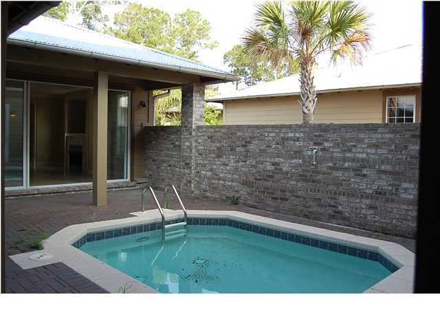 492 West Harborview Road Santa Rosa Beach, FL 32459 - Photo 3 of 16 a backyard of a house with seating space