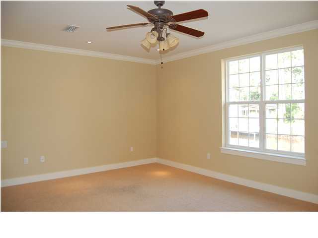 492 West Harborview Road Santa Rosa Beach, FL 32459 - Photo 9 of 16 a room with a window and a ceiling fan