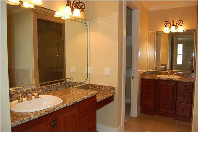 492 West Harborview Road Santa Rosa Beach, FL 32459 - Photo 10 of 16 a bathroom with a granite countertop sink a mirror and a shower